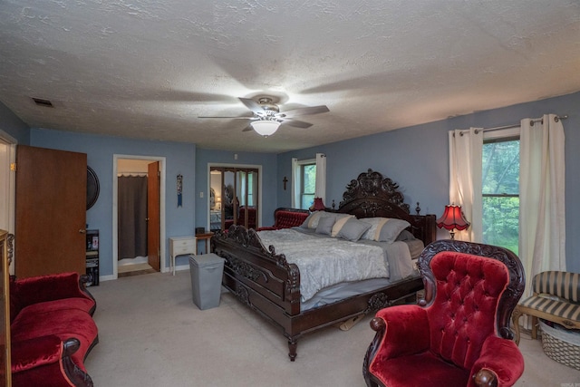 3209 Jack Mann Rd, Little Rock, AR 72210 - bedroom with multiple windows, carpet floors, a textured ceiling, and a ceiling fan
