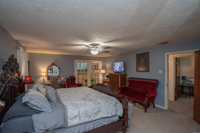 3209 Jack Mann Rd, Little Rock, AR 72210 - bedroom featuring french doors, light carpet, a ceiling fan, and a textured ceiling