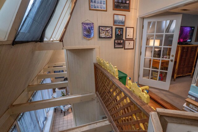 3209 Jack Mann Rd, Little Rock, AR 72210 - stairs with wooden walls and carpet