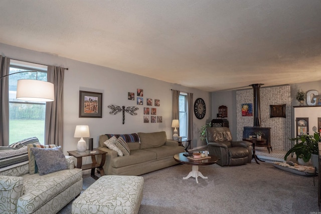 3209 Jack Mann Rd, Little Rock, AR 72210 - carpeted living room with a wood stove and healthy amount of natural light