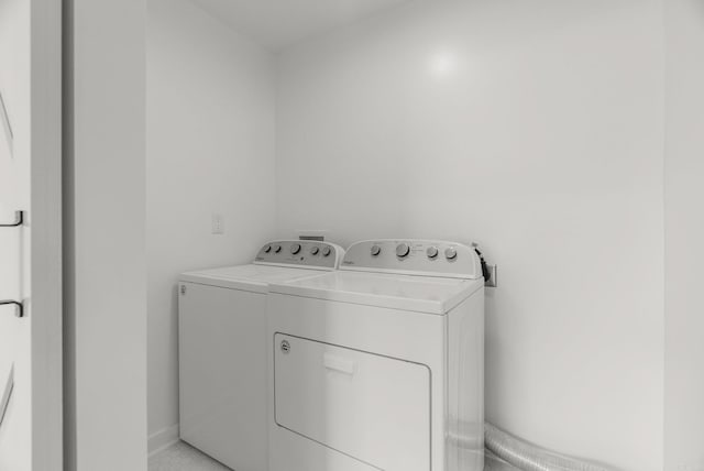 125 Englewood Rd, Little Rock, AR 72207 - laundry room with washer and dryer and baseboards