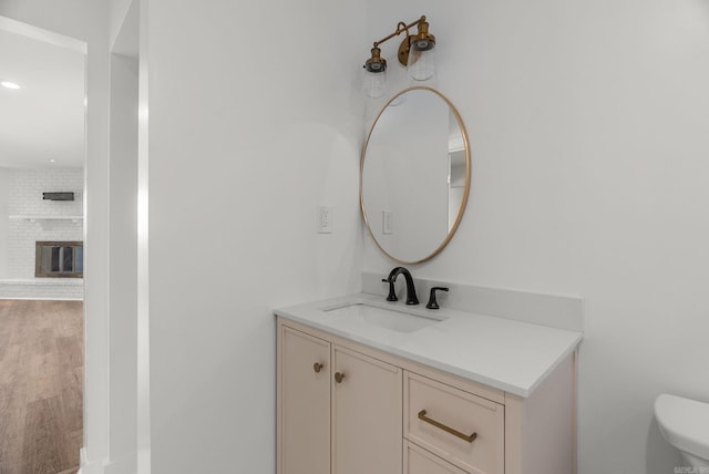 125 Englewood Rd, Little Rock, AR 72207 - bathroom featuring vanity, wood finished floors, and recessed lighting