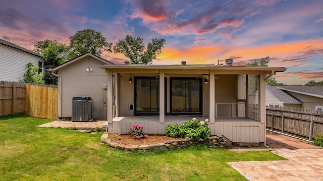125 Englewood Rd, Little Rock, AR 72207 - back of property at dusk featuring a fenced backyard