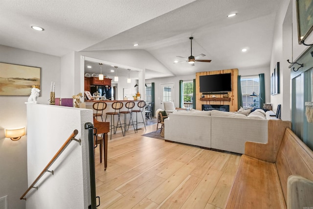 1905 Highgrove Rd, Harrison, AR 72601 - living room featuring ceiling fan, light wood-style floors, recessed lighting, lofted ceiling, and a textured ceiling