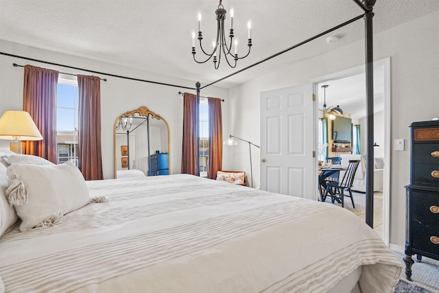 1905 Highgrove Rd, Harrison, AR 72601 - bedroom featuring a chandelier and a textured ceiling