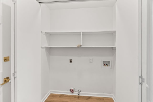 8719 Evergreen Dr, Little Rock, AR 72227 - laundry area with washer hookup, light wood-style floors, hookup for an electric dryer, and hookup for a gas dryer