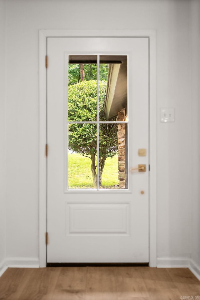 8719 Evergreen Dr, Little Rock, AR 72227 - entryway with baseboards and wood finished floors