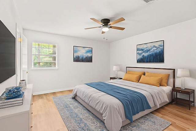 8719 Evergreen Dr, Little Rock, AR 72227 - bedroom featuring light wood-style flooring and ceiling fan
