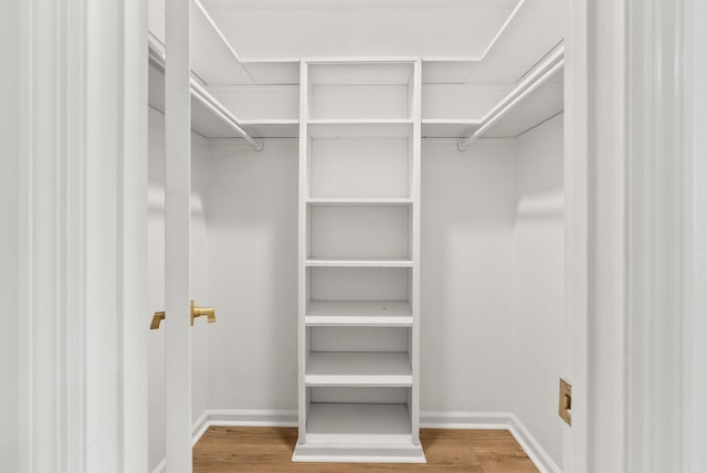 8719 Evergreen Dr, Little Rock, AR 72227 - walk in closet featuring wood finished floors