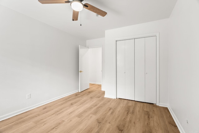 8719 Evergreen Dr, Little Rock, AR 72227 - unfurnished bedroom with wood finished floors, a closet, and a ceiling fan