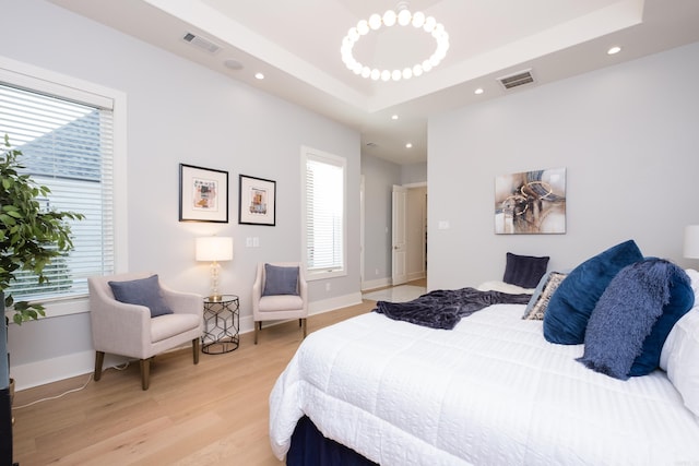 111 Mergeron Ct, Little Rock, AR 72212 - bedroom featuring light wood-type flooring, recessed lighting, and a raised ceiling