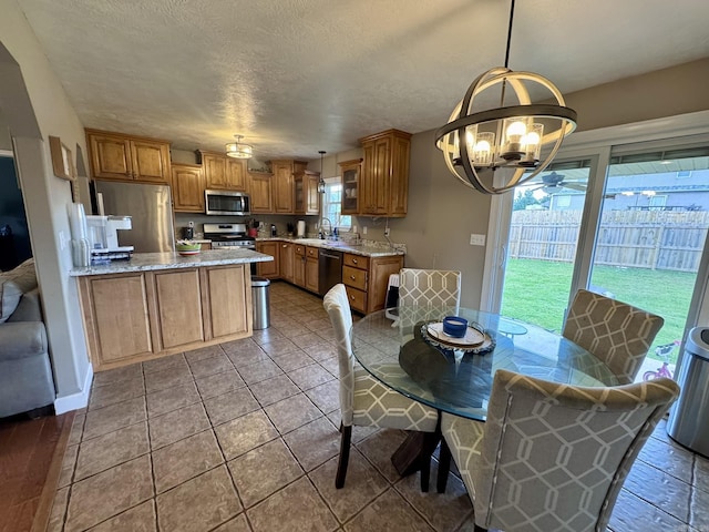 389 Plantation Cir, Melbourne, AR 72556 - dining space with a chandelier and a textured ceiling
