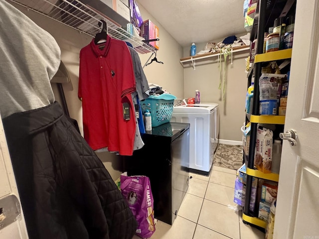 389 Plantation Cir, Melbourne, AR 72556 - laundry room with washer and clothes dryer and tile patterned floors