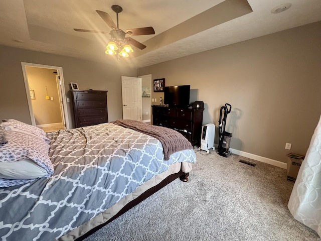 389 Plantation Cir, Melbourne, AR 72556 - carpeted bedroom with a tray ceiling and ceiling fan