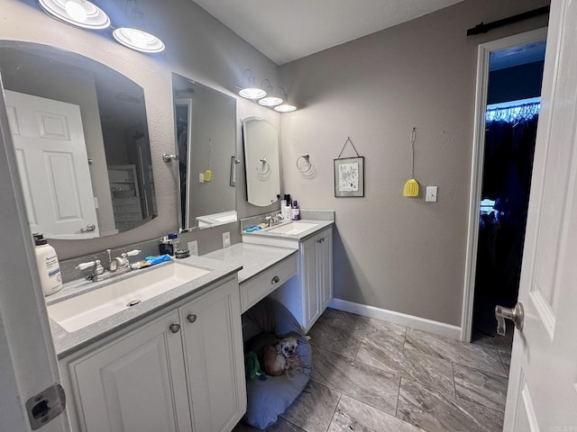 389 Plantation Cir, Melbourne, AR 72556 - full bath with vanity, a walk in closet, and marble look tile flooring