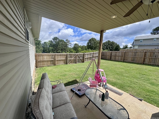 389 Plantation Cir, Melbourne, AR 72556 - fenced backyard with a ceiling fan and a patio area