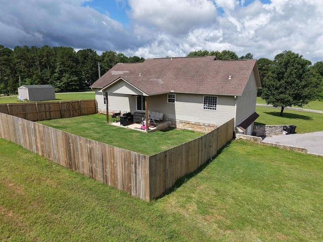 389 Plantation Cir, Melbourne, AR 72556 - rear view of property with a patio area, a fenced backyard, and a shingled roof