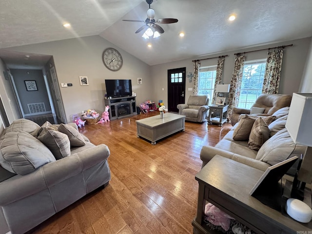 389 Plantation Cir, Melbourne, AR 72556 - living area featuring vaulted ceiling, a ceiling fan, light wood finished floors, and recessed lighting