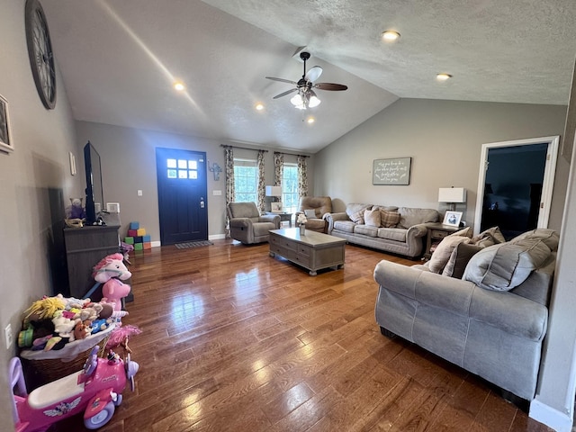 389 Plantation Cir, Melbourne, AR 72556 - living room featuring vaulted ceiling, ceiling fan, wood finished floors, and a textured ceiling