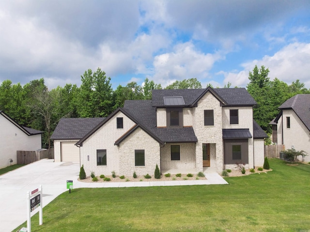 14509 Stonebrook Ln, Maumelle, AR 72113 - view of front of house featuring concrete driveway, roof with shingles, a garage, a standing seam roof, and brick siding
