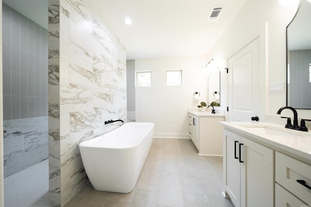 14509 Stonebrook Ln, Maumelle, AR 72113 - full bath featuring a soaking tub, two vanities, walk in shower, recessed lighting, and tile walls