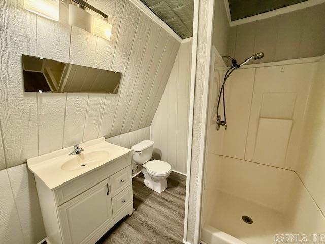 1520 S Main St, Malvern, AR 72104 - full bath featuring wood finished floors, a shower stall, and vanity