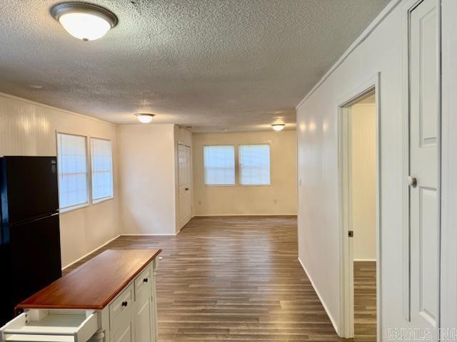 1520 S Main St, Malvern, AR 72104 - corridor featuring a textured ceiling, ornamental molding, and wood finished floors