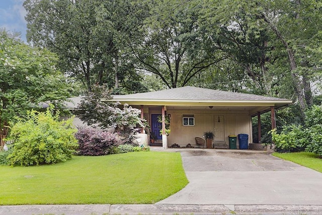 42 Bradford, Little Rock, AR 72227 - view of front of house with a front lawn, concrete driveway, a carport, and board and batten siding