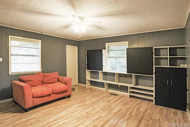 42 Bradford, Little Rock, AR 72227 - living area with a ceiling fan, wood finished floors, and a textured ceiling