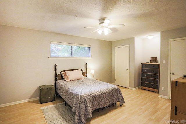 42 Bradford, Little Rock, AR 72227 - bedroom with light wood finished floors, a textured ceiling, and a ceiling fan