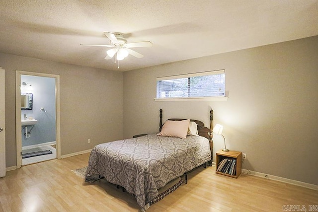 42 Bradford, Little Rock, AR 72227 - bedroom with wood finished floors, connected bathroom, and a ceiling fan