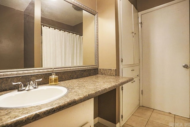 42 Bradford, Little Rock, AR 72227 - bathroom with vanity and tile patterned flooring