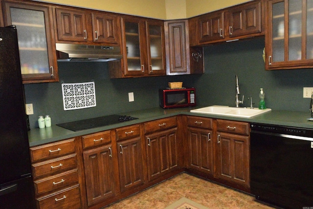 6 Lendl Loop, Little Rock, AR 72210 - kitchen featuring under cabinet range hood, black appliances, glass insert cabinets, tasteful backsplash, and dark brown cabinetry