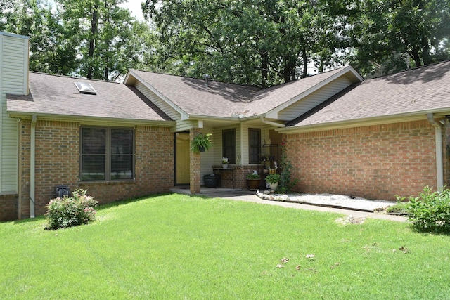 6 Lendl Loop, Little Rock, AR 72210 - view of front of property featuring brick siding, roof with shingles, and a front yard