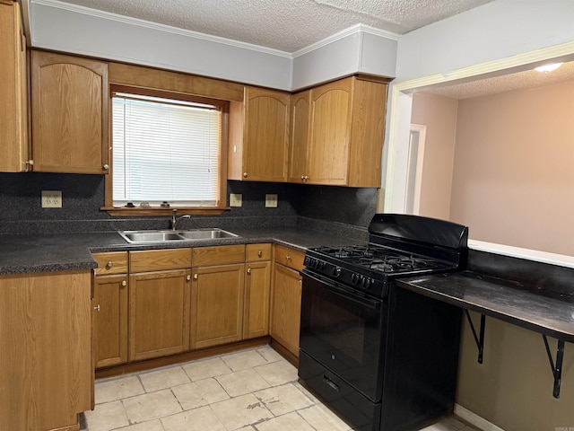 4704 Massie St, North Little Rock, AR 72118 - kitchen featuring black range with gas cooktop, dark countertops, a textured ceiling, light tile patterned floors, and brown cabinetry