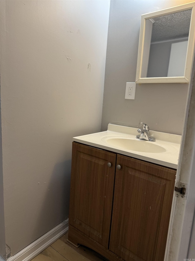 4704 Massie St, North Little Rock, AR 72118 - bathroom featuring vanity and wood finished floors