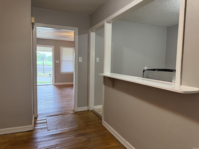 4704 Massie St, North Little Rock, AR 72118 - hall featuring a textured ceiling and wood finished floors