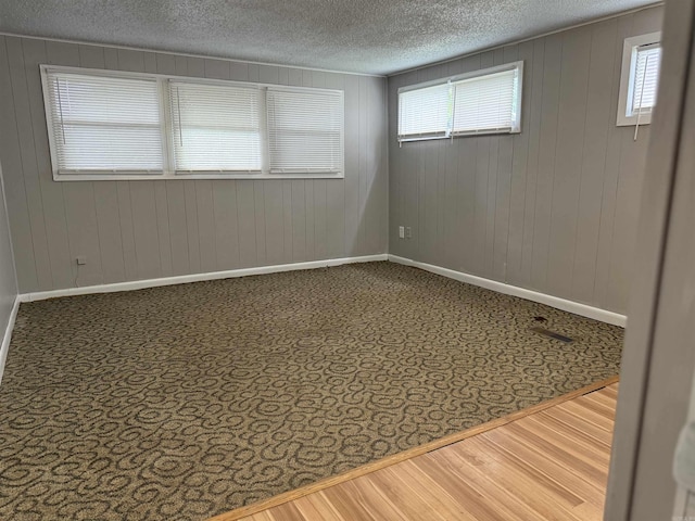 4704 Massie St, North Little Rock, AR 72118 - unfurnished room with a textured ceiling and wooden walls