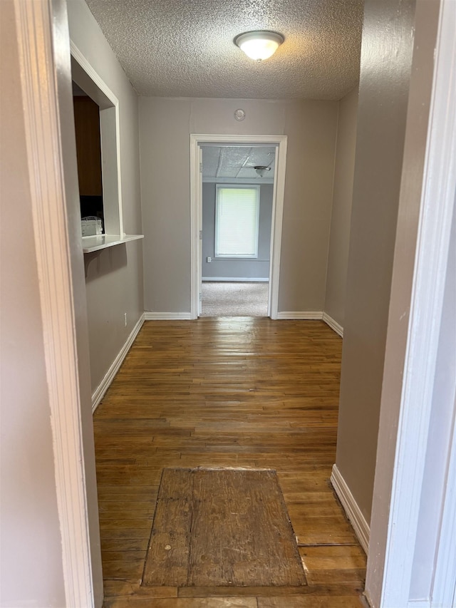 4704 Massie St, North Little Rock, AR 72118 - corridor featuring wood-type flooring and a textured ceiling