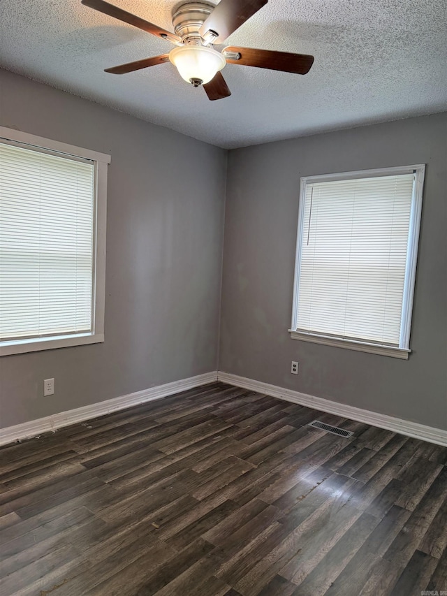4704 Massie St, North Little Rock, AR 72118 - empty room with dark wood-type flooring, ceiling fan, and a textured ceiling
