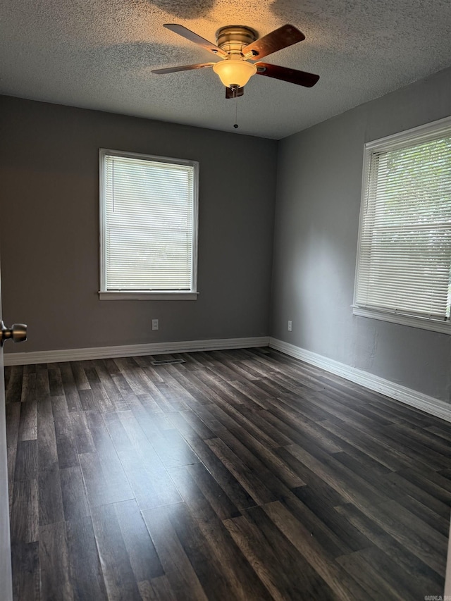 4704 Massie St, North Little Rock, AR 72118 - unfurnished room featuring ceiling fan, dark wood-style flooring, and a textured ceiling