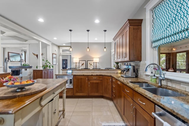 1116 Kavanaugh Blvd, Little Rock, AR 72205 - kitchen with dishwasher, brown cabinetry, a peninsula, light tile patterned floors, and recessed lighting
