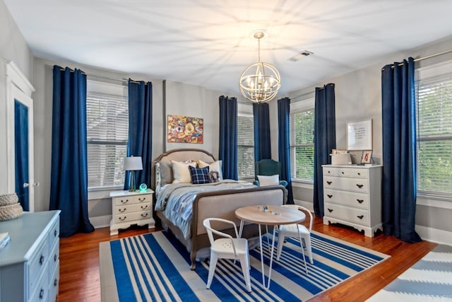 1116 Kavanaugh Blvd, Little Rock, AR 72205 - bedroom featuring a chandelier and wood finished floors