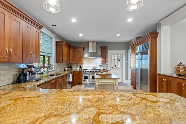 1116 Kavanaugh Blvd, Little Rock, AR 72205 - kitchen with wall chimney exhaust hood, premium appliances, light stone counters, tasteful backsplash, and recessed lighting