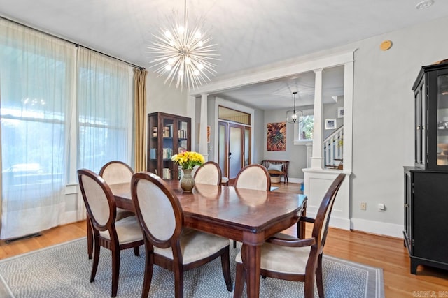 1116 Kavanaugh Blvd, Little Rock, AR 72205 - dining space featuring a chandelier and light wood-style floors