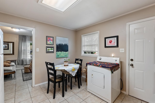 2515 N Dr, North Little Rock, AR 72118 - dining space featuring washer / dryer, crown molding, and light tile patterned floors