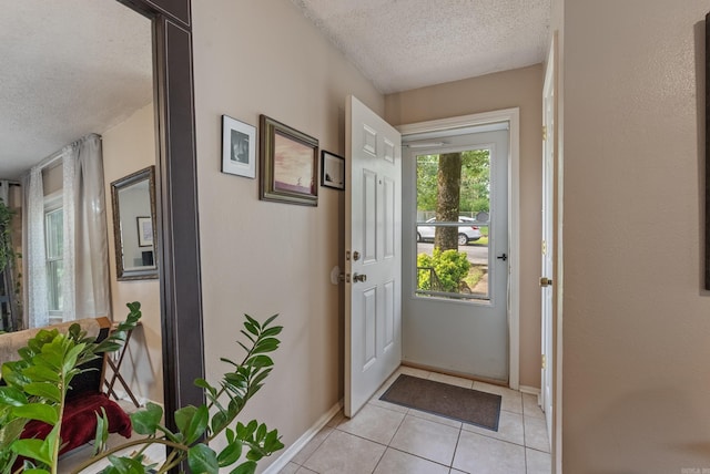 2515 N Dr, North Little Rock, AR 72118 - doorway to outside with a textured ceiling and light tile patterned flooring