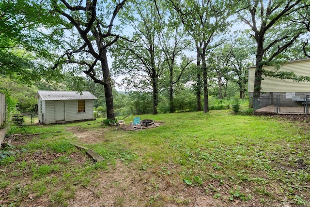 2515 N Dr, North Little Rock, AR 72118 - fenced backyard with an outdoor fire pit and a shed