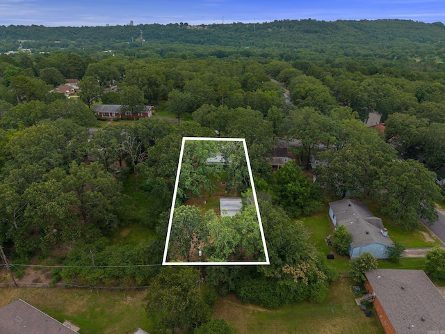 2515 N Dr, North Little Rock, AR 72118 - aerial view of property and surrounding area featuring a heavily wooded area and property boundaries highlighted