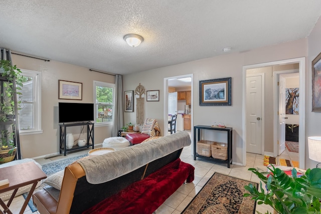2515 N Dr, North Little Rock, AR 72118 - living room with light tile patterned floors and a textured ceiling